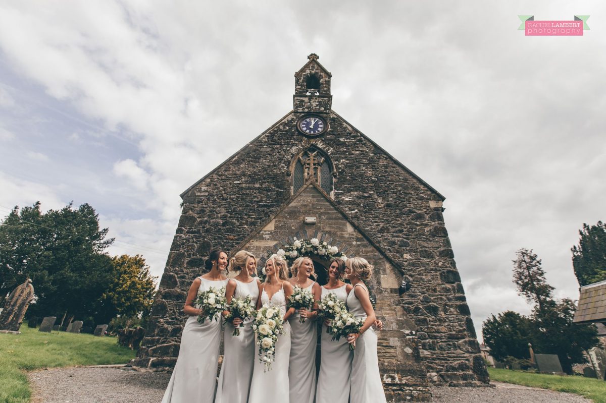 bridesmaids and bride outside church wedding