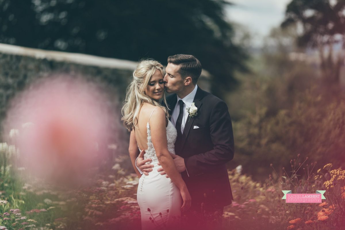 bride and groom wedding kissing flower garden the grove narberth