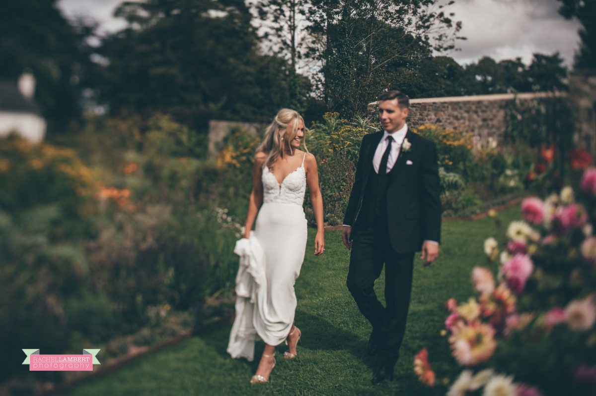 bride and groom wedding walking flower garden the grove narberth