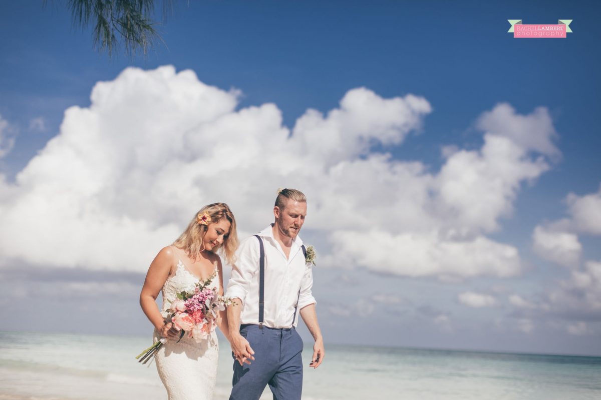 walking on beach bridal flowers bride and groom jamaica