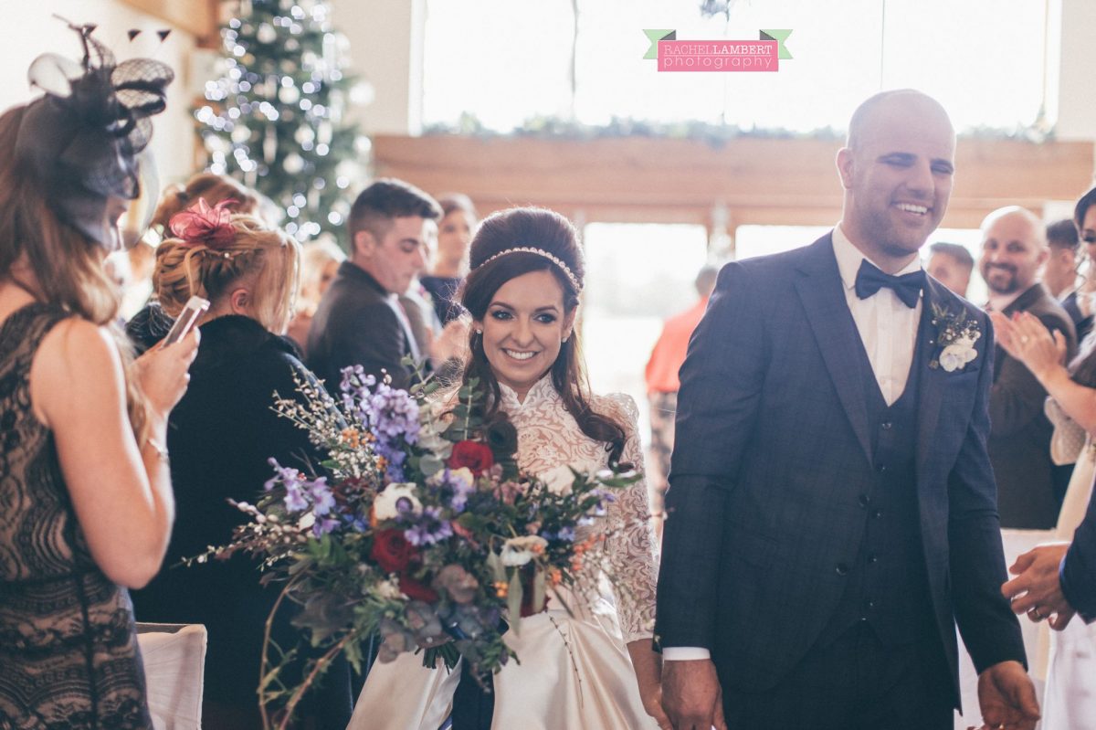 bride and groom walking down aisle at oldwalls