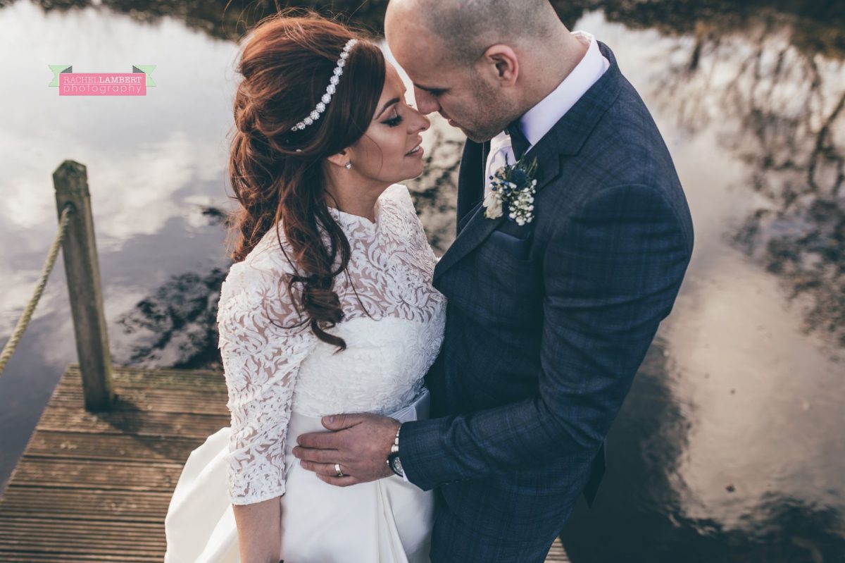 bride and groom on lake at oldwalls