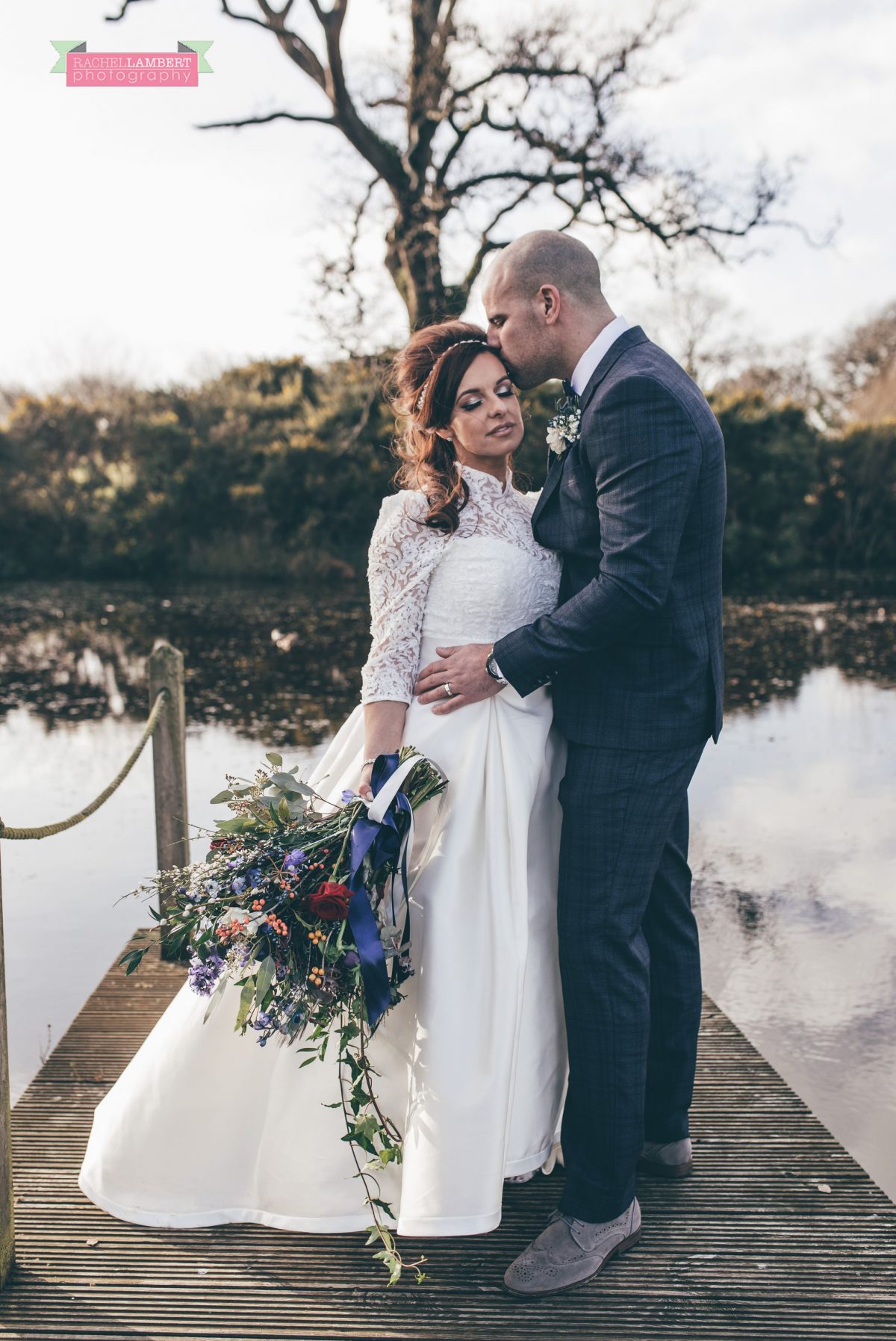  bride and groom on lake at oldwalls