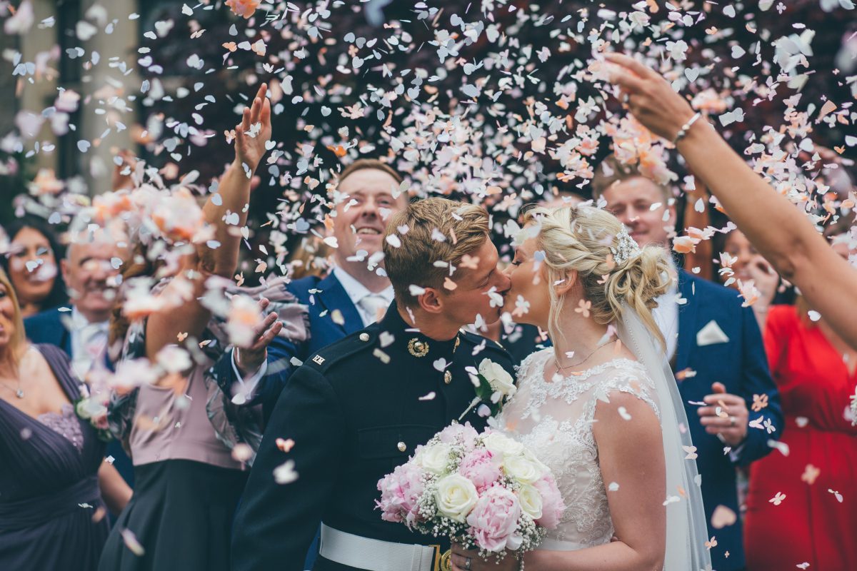 confetti shot at miskin manor with guests and bride and groom rachel lambert photography