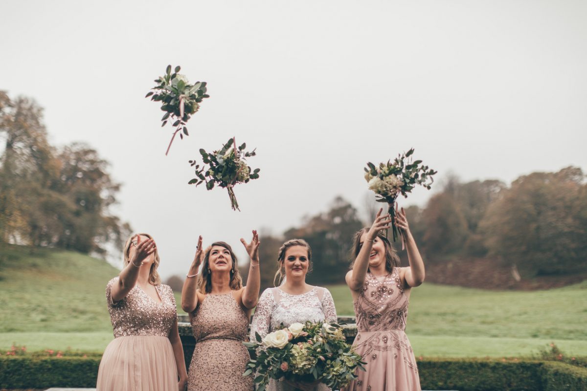bridesmaids and bride throwing bouquet wedding at newton house llandeilo