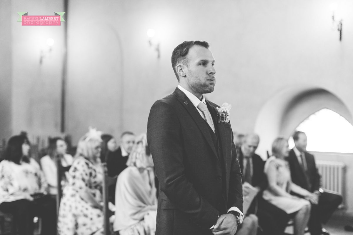wedding in italy colour cortona tuscany black and white town ceremony groom waiting for his bride