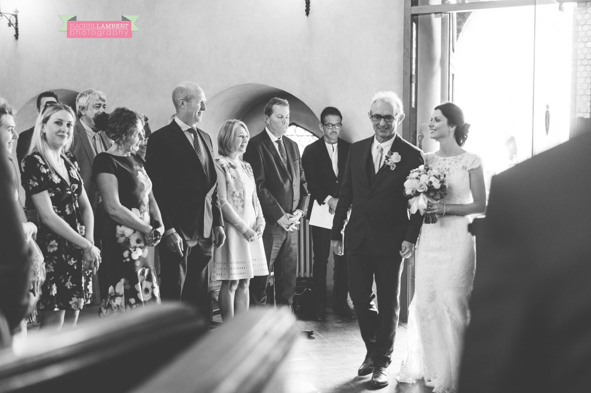 bride and groom portrait wedding in italy colour cortona tuscany black and white town ceremony bride entering 