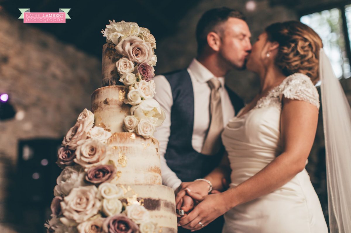 rachel lambert photography bride and groom pencoed house cutting the cake
