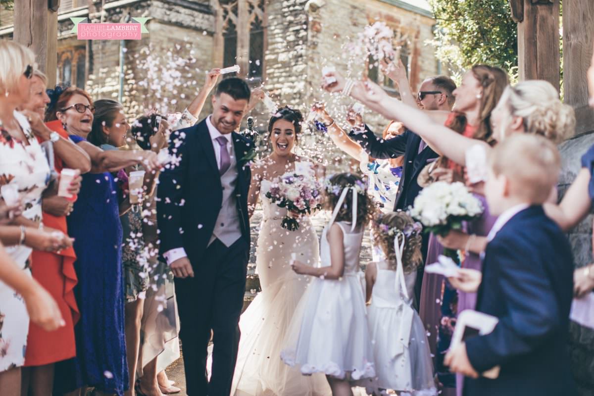 olwalls wedding photographer rachel lambert photography bride and groom in st peters church newton confetti