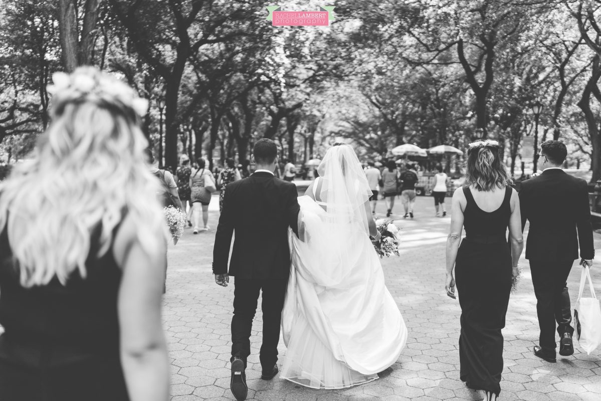rachel lambert photography new york wedding photos bride and groom wedding party walking through central park