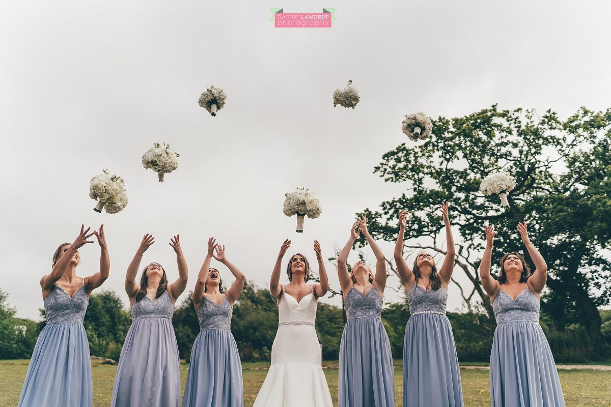 oldwalls wedding photographer bride and bridesmaids throwing bouquets