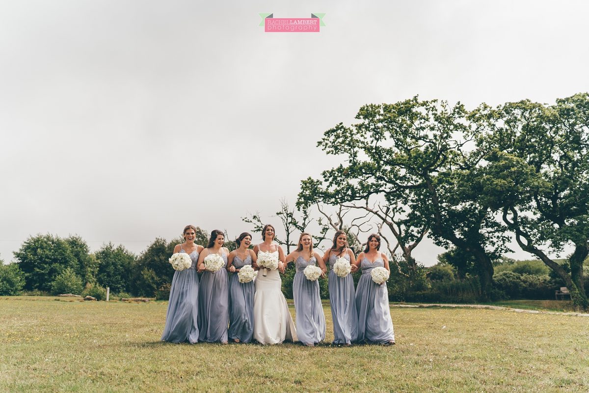 oldwalls wedding photographer bride and bridesmaids walking 