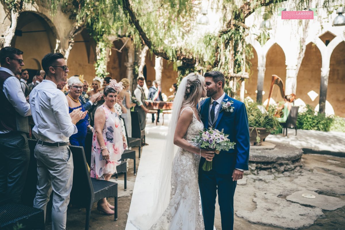 wedding photographer sorrento italy bride and groom chiostro di san francesco laura may bridal walking down the aisle