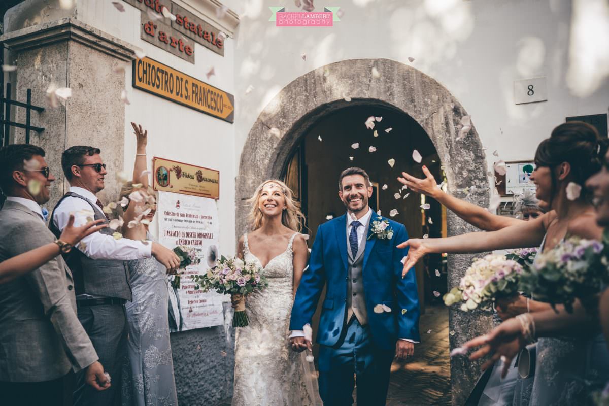 wedding photographer sorrento italy bride and groom chiostro di san francesco laura may bridal confetti