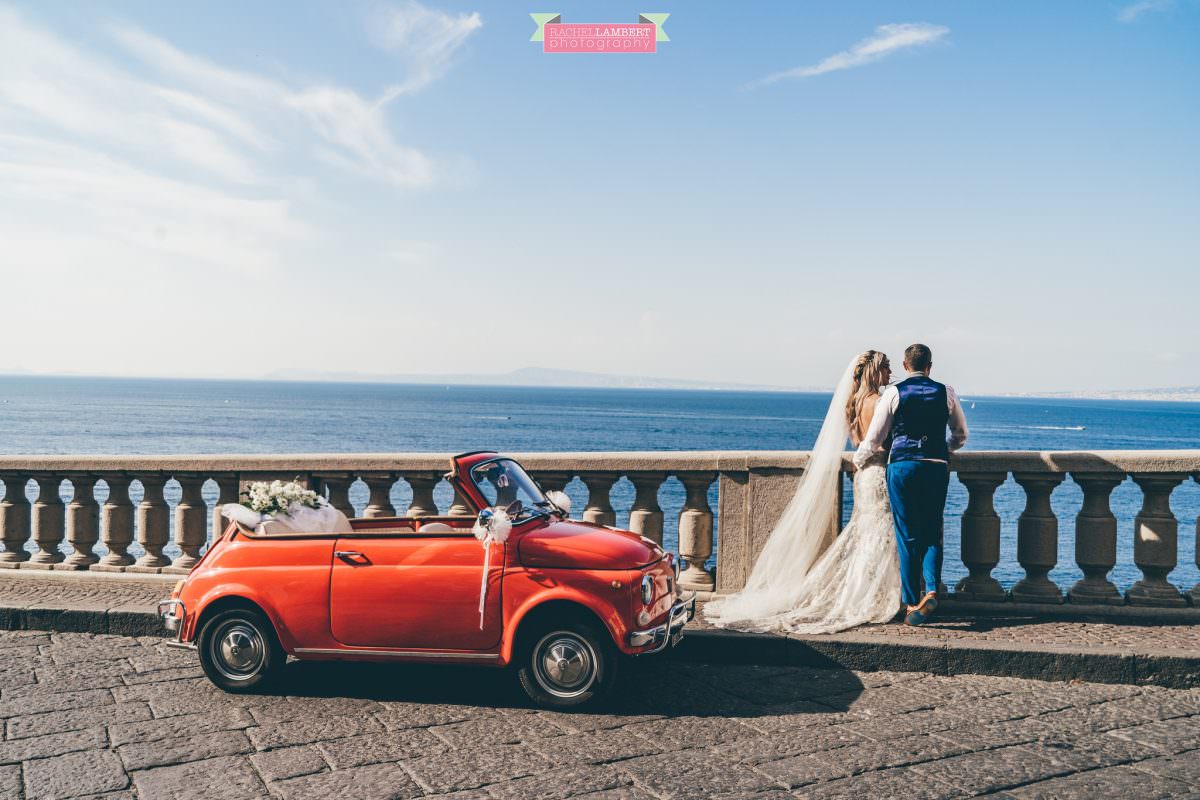 wedding photographer sorrento italy bride and groom mount vesuvius views amalfi red fiat
