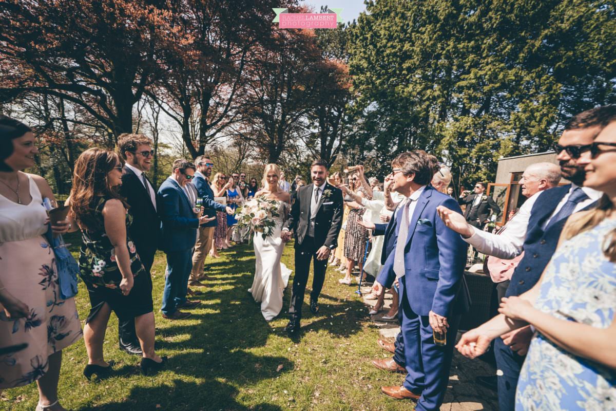 fairyhill gower rachel lambert photography bride and groom confetti shot