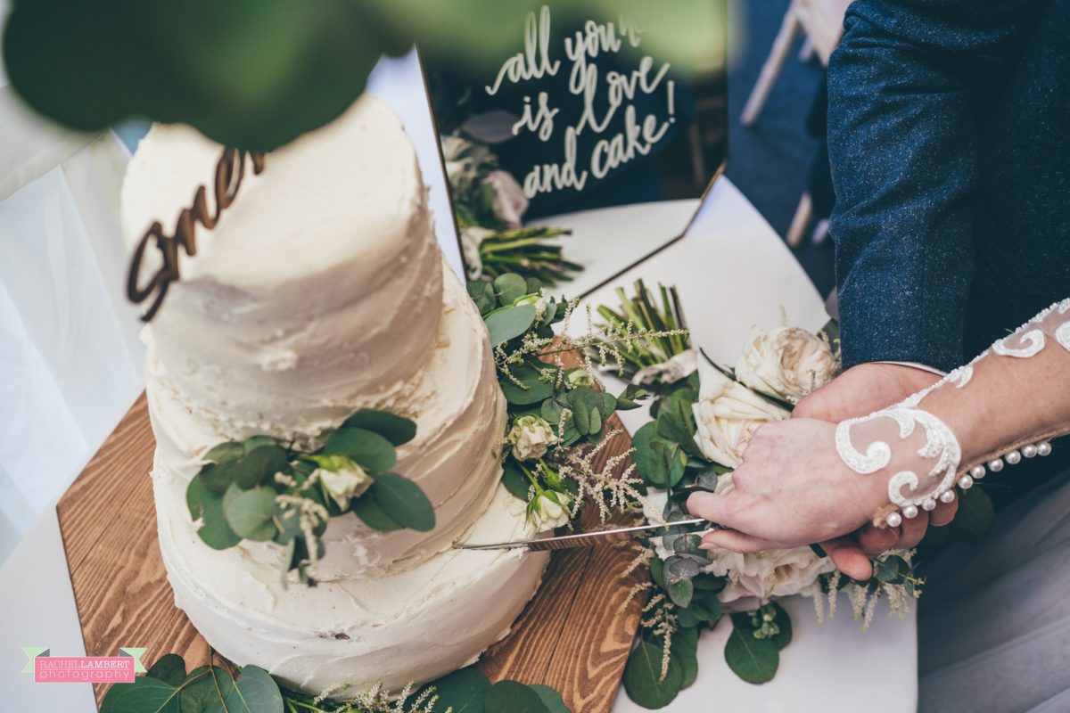cardiff wedding photographer llanerch vineyard cutting the cake