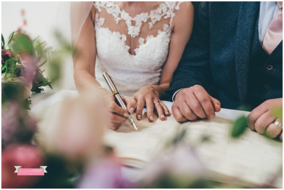 cardiff wedding photographer miskin manor rachel lambert photography bride and groom signing the register